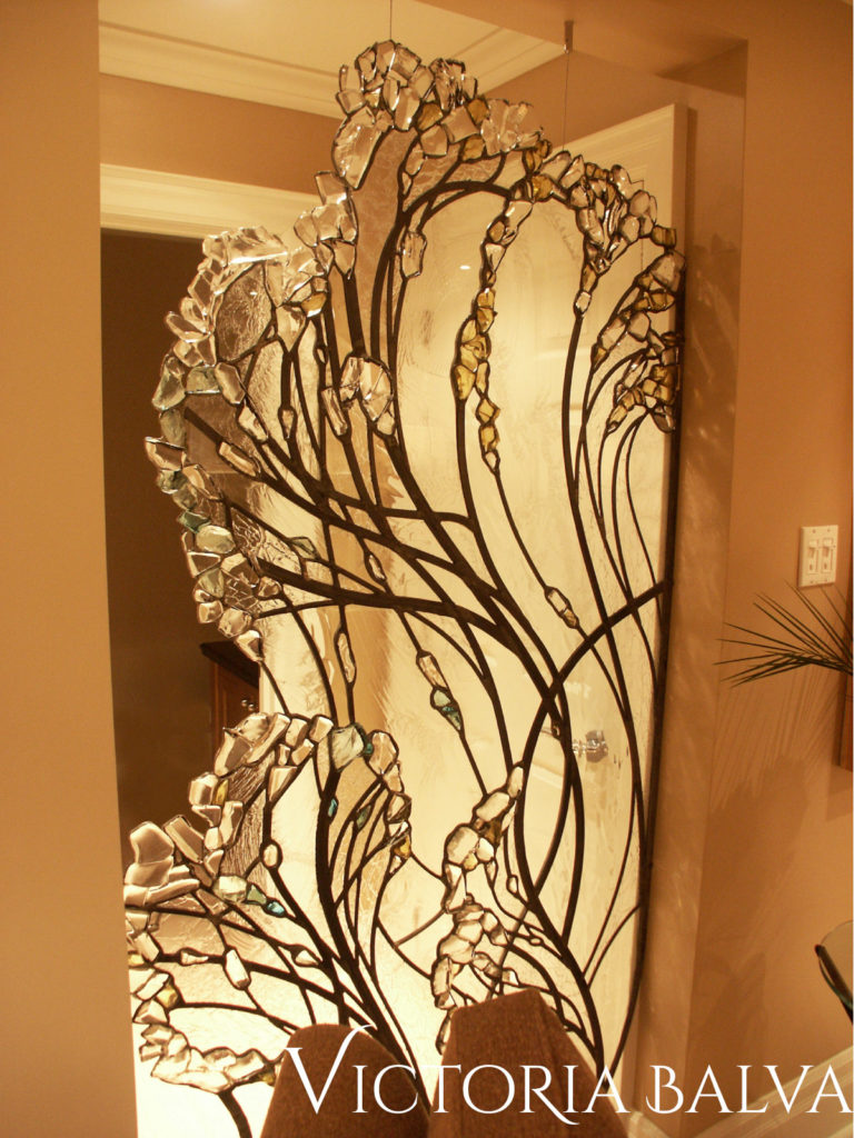 Contemporary decorative glass wall divider for a living room designed by Kimberley Seldon