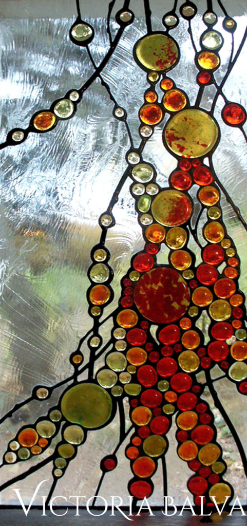 Contemporary art glass windows with red and amber glass nuggets on a cold textured Duncan glass