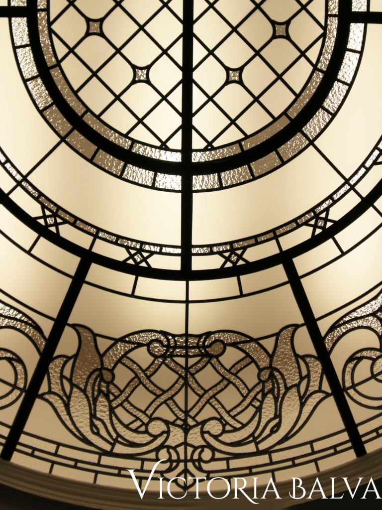 Classic oval stained and leaded glass ceiling with acanthus