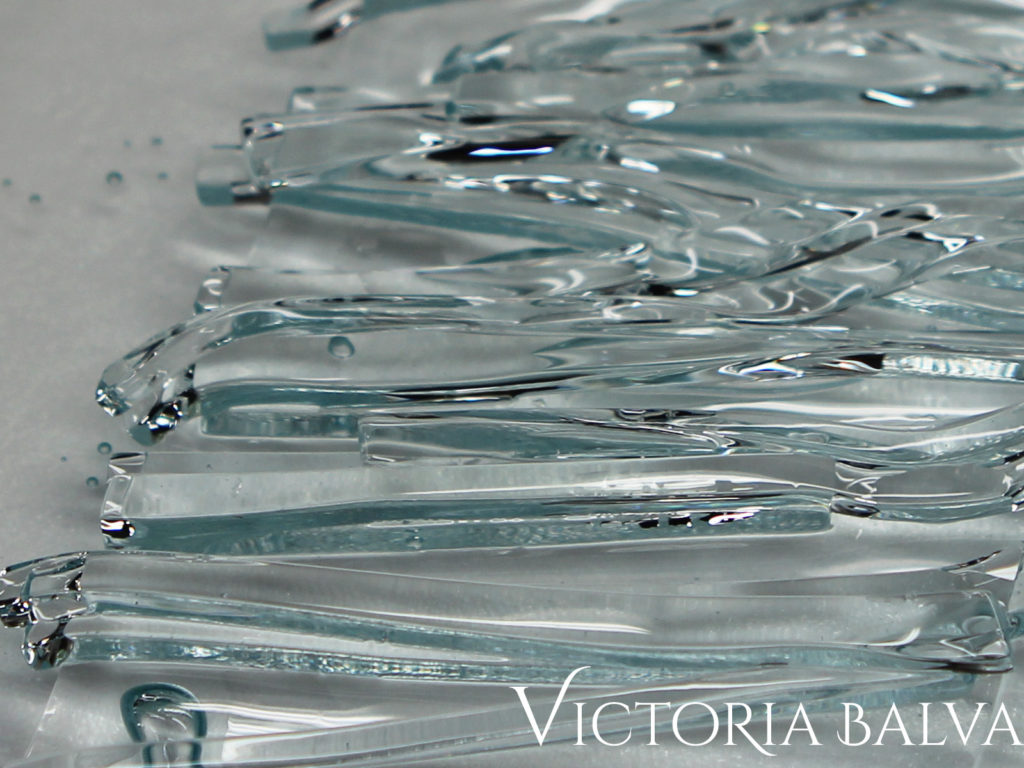 Fused clear glass texture on a clear cast base