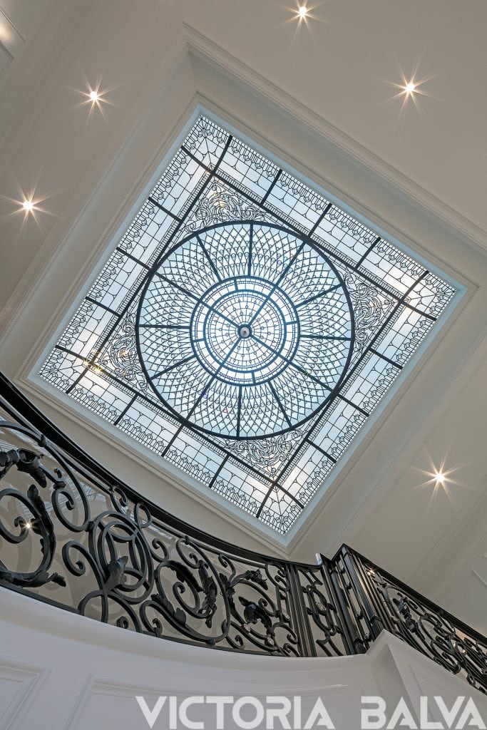 Large stained and leaded glass domed ceiling for the double height grand entrance foyer