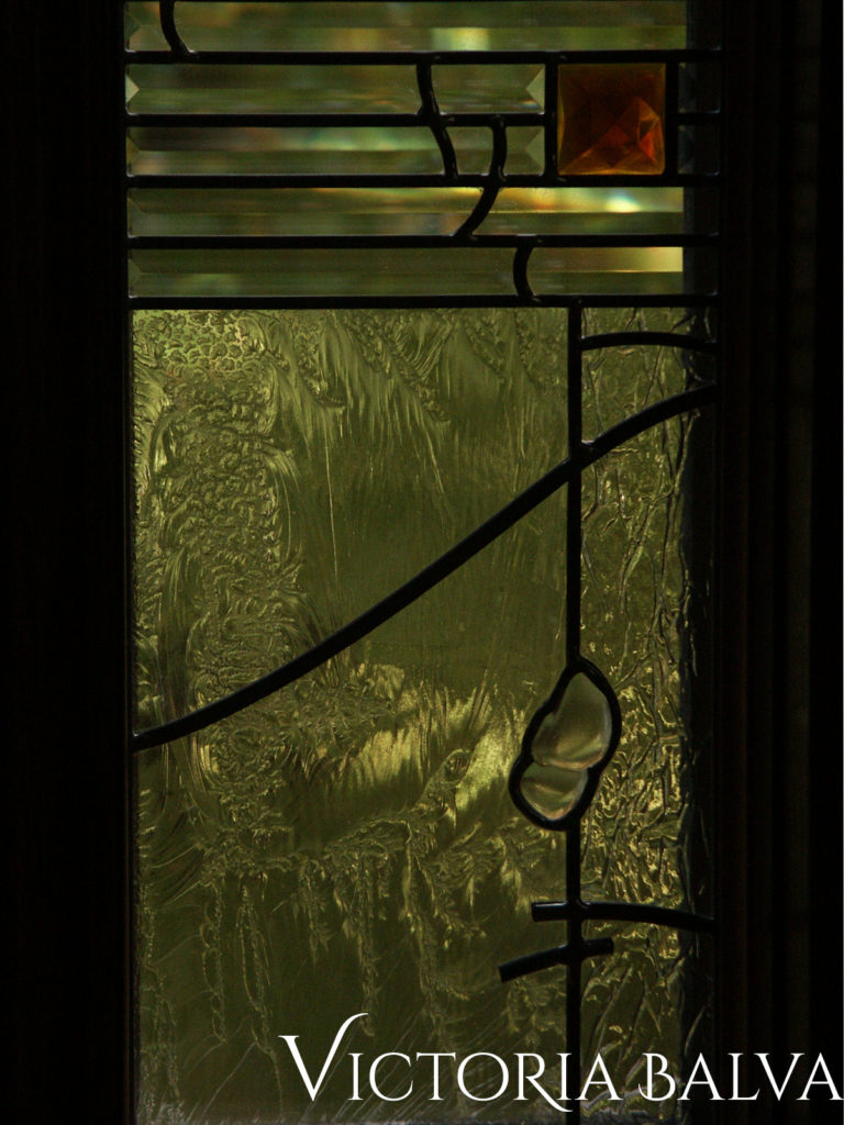 Stained and leaded glass window detail with fused and bevelled glass