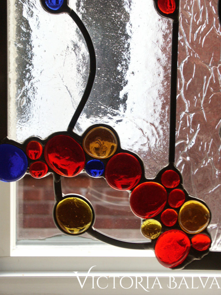 Modern stained glass design with bright colourful glass nuggets
