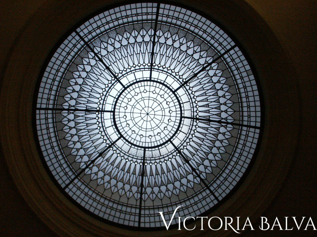 Dramatic stained and leaded glass dome ceiling for a double height entrance foyer of a custom built home in Vaughan