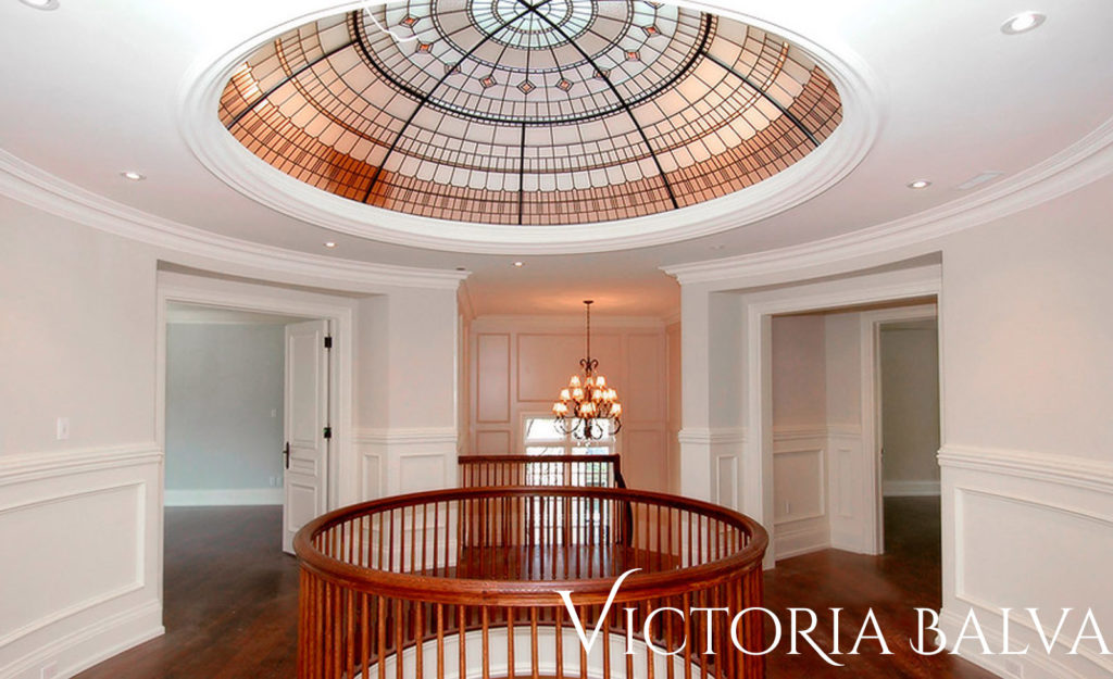 Stained and leaded glass dome for a circular hallway hallway of a custom built residence by Merit Homes Inc
