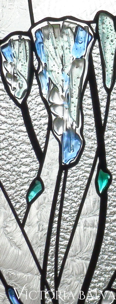 pale blue and clear fused glass detail of a leaded glass door light in abstract modern style